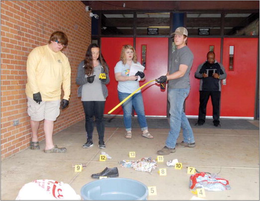 Academies of West Memphis students at the scene of the crime